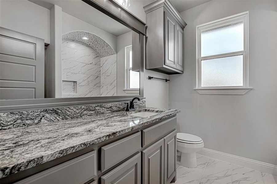 Bathroom with toilet and vanity