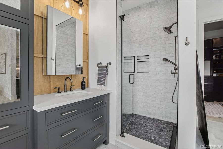 Primary Bathroom with marble tile and Robern Medicine Cabinets Primary Bathroom with marble tile and Robern Medicine Cabinets