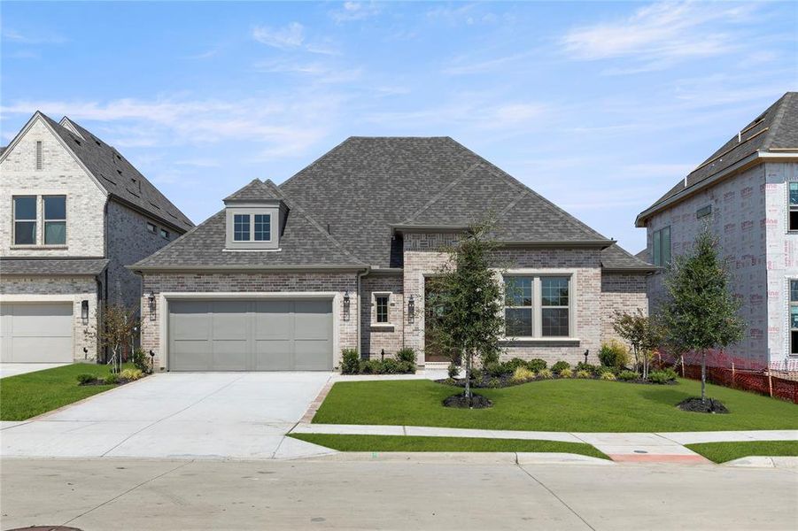 Front exterior of a new home in Lakewood at Brookhollow – 60′, Prosper, TX, highlighting curb appeal (Image 25). Front exterior of a new home in Lakewood at Brookhollow – 60′, Prosper, TX, highlighting curb appeal (Image 25).