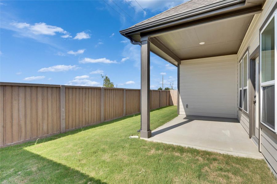 Fenced backyard with a patio Fenced backyard with a patio