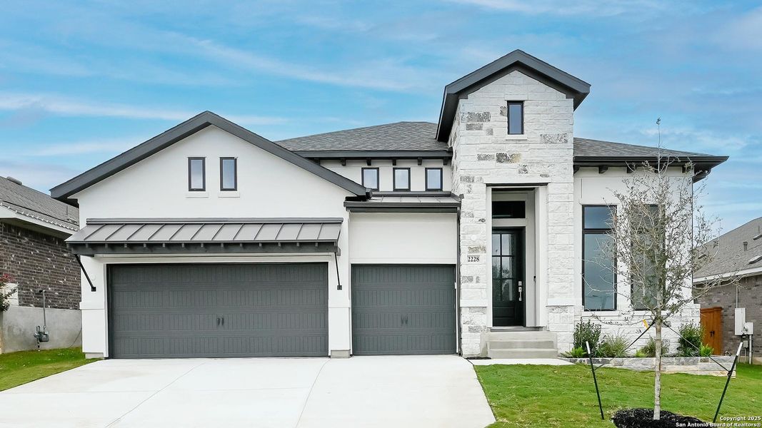 Front exterior of a new home in Veramendi 60', New Braunfels, TX, highlighting curb appeal (Image 2).