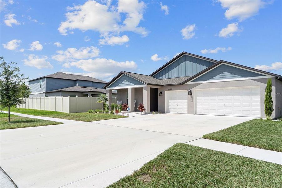 Front exterior of a new home in Balm Grove, Wimauma, FL, highlighting curb appeal (Image 2).