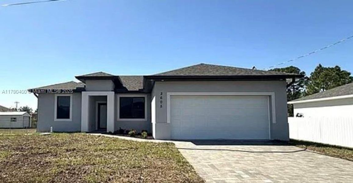 Front exterior of a new home in , Lehigh Acres, FL, highlighting curb appeal (Image 1). Front exterior of a new home in , Lehigh Acres, FL, highlighting curb appeal (Image 1).