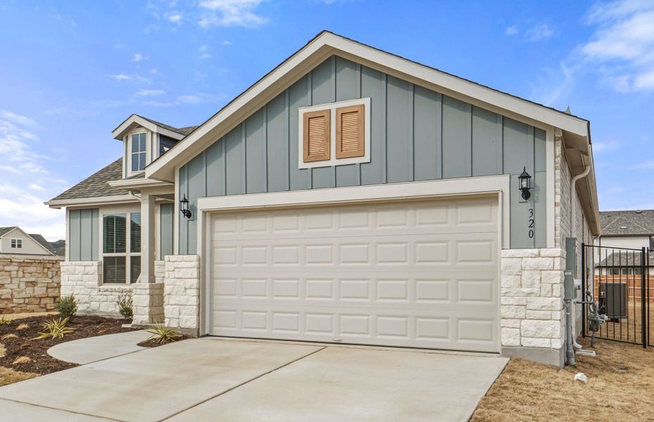 Front exterior of a new home in Saddleback at Santa Rita Ranch, Liberty Hill, TX, highlighting curb appeal (Image 22). Front exterior of a new home in Saddleback at Santa Rita Ranch, Liberty Hill, TX, highlighting curb appeal (Image 22).