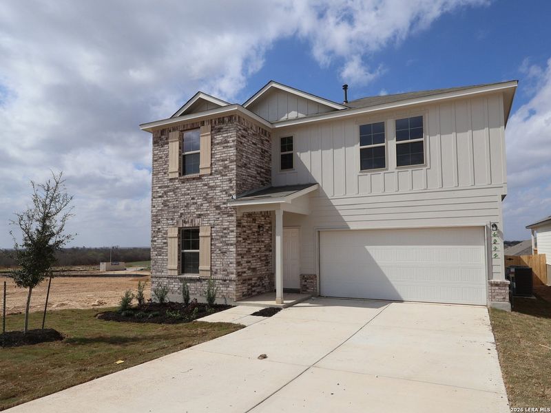 Front exterior of a new home in Mesquite Ridge, San Antonio, TX, highlighting curb appeal (Image 1). Front exterior of a new home in Mesquite Ridge, San Antonio, TX, highlighting curb appeal (Image 1).
