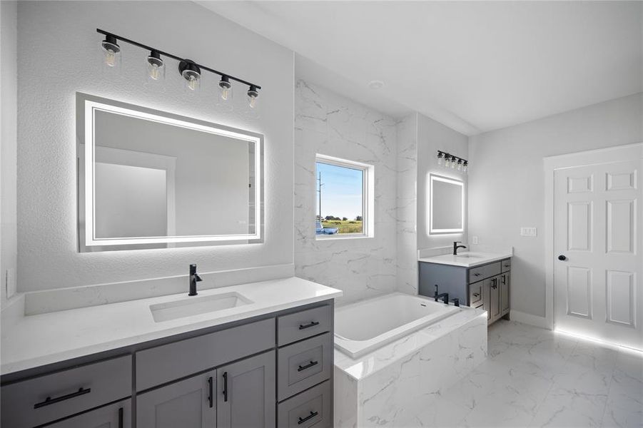LED lighted mirrors, separate vanities, plenty of storage, and a large soaking tub with a spa-like feel to recharge