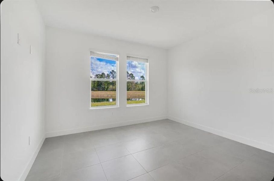 Spacious, unfurnished interior of a new home in Harvest at Ovation, Winter Garden (Image 9).