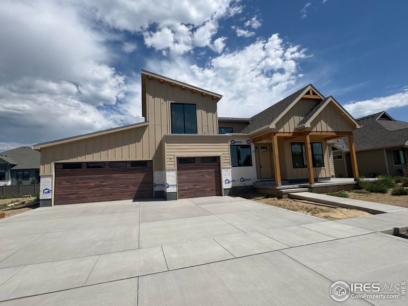 Front exterior of a new home in , Berthoud, CO, highlighting curb appeal (Image 27). Front exterior of a new home in , Berthoud, CO, highlighting curb appeal (Image 27).
