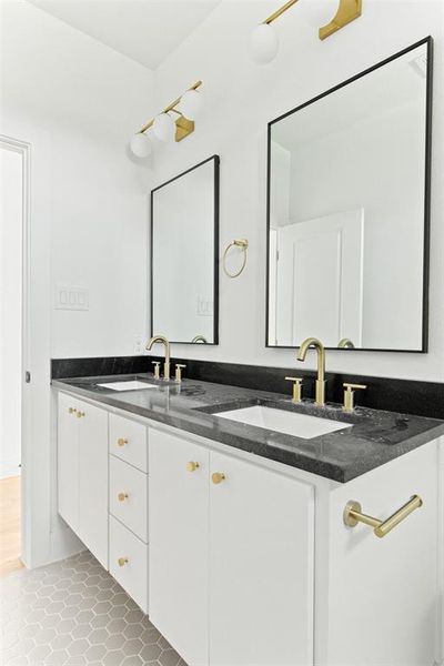 Bathroom featuring tile flooring and double vanity