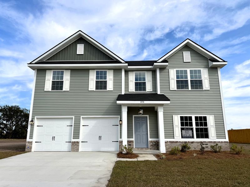 Front exterior of a new home in Tibet Road at Sassafras, Allenhurst, GA, highlighting curb appeal (Image 1).