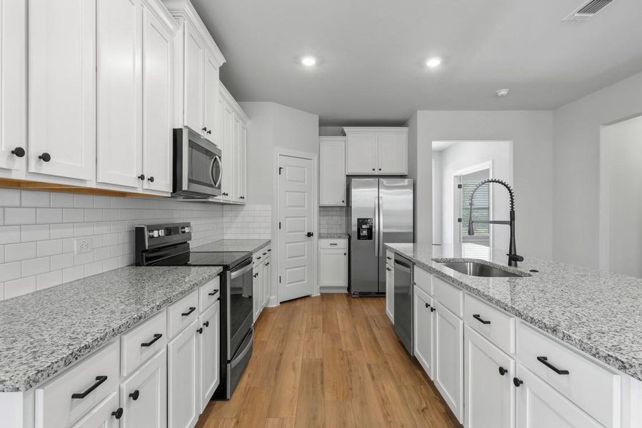 Furnished interior view inside a new home in Whisper Valley, Manor (Image 6).