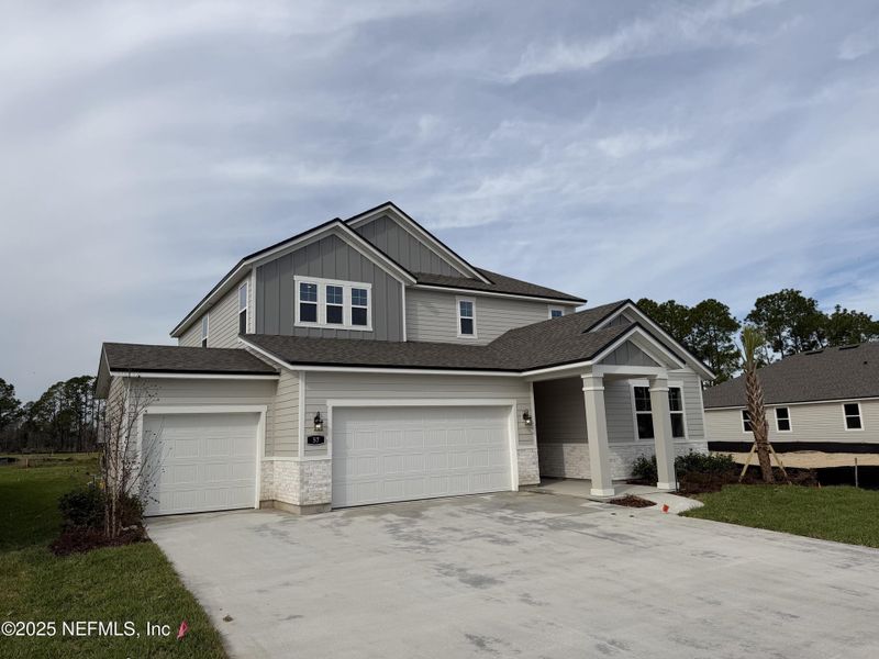Front exterior of a new home in , Flagler Beach, FL, highlighting curb appeal (Image 25).