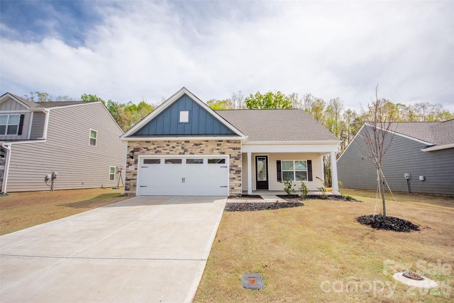 Front exterior of a new home in Colonial Crossing, Troutman, NC, highlighting curb appeal (Image 20).