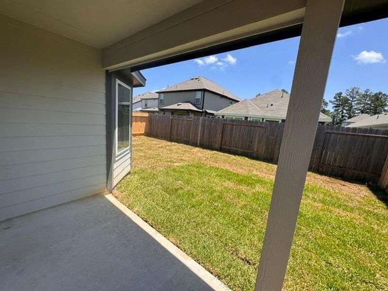 Exterior details and patio area of a home in Townsend Reserve, Splendora (Image 3).