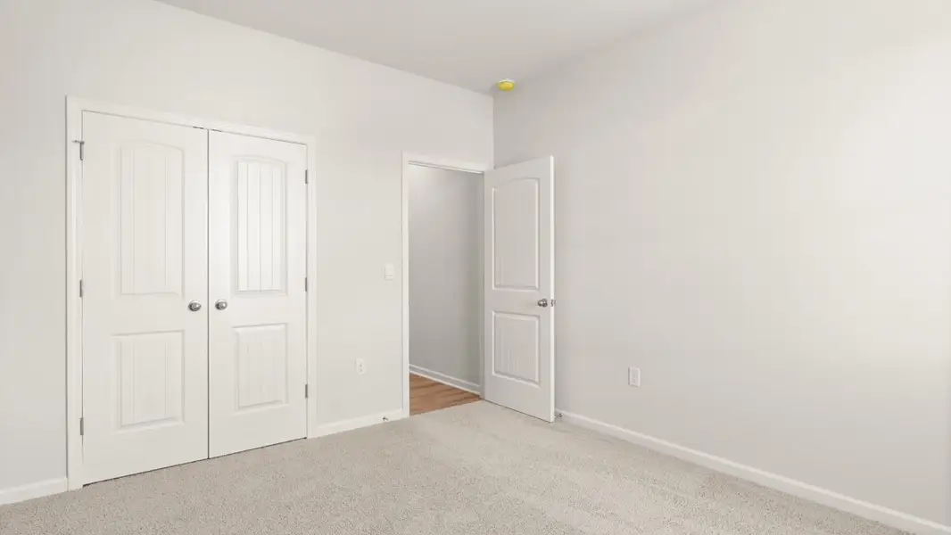 Representative unfurnished interior of a home built from the Halton by D.R. Horton in Liberty Crossing, Braselton (Image 21).