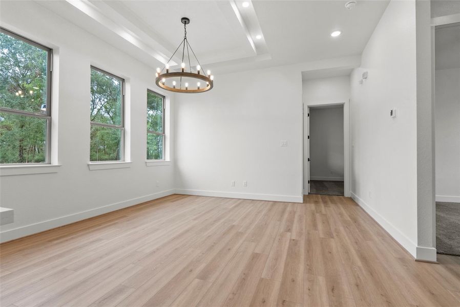 Living area also features a tray ceiling for depth and style Living area also features a tray ceiling for depth and style