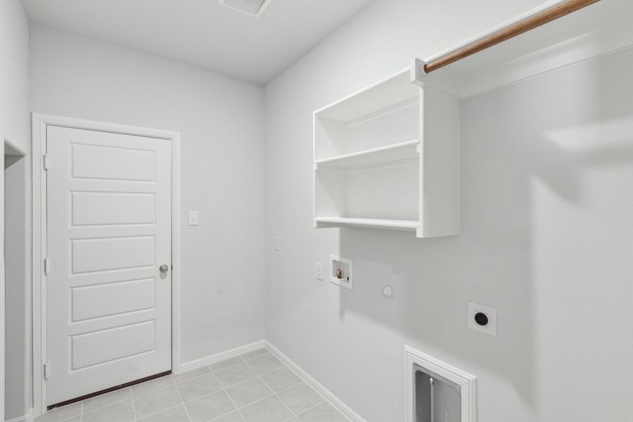 Utility Room in the Holden home plan by Trophy Signature Homes – REPRESENTATIVE PHOTO