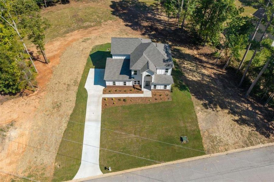 Front exterior of a new home in , Snellville, GA, highlighting curb appeal (Image 21).