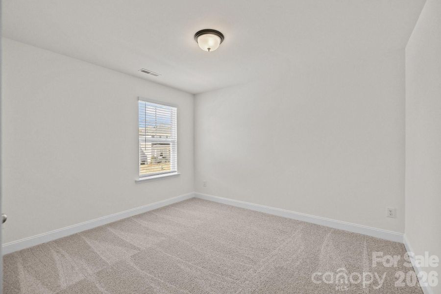 Secondary BedroomPhotos are representative and may not reflect the exact home, finishes, or features.