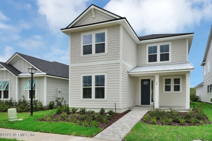 Front exterior of a new home in Seabrook Village at Seabrook, Nocatee, FL, highlighting curb appeal (Image 22).