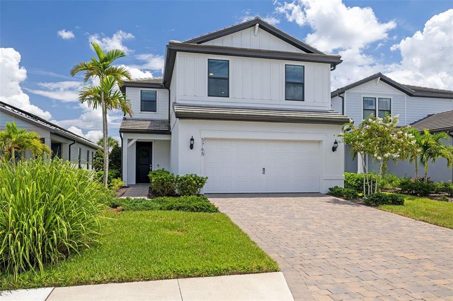 Front exterior of a new home in , Bradenton, FL, highlighting curb appeal (Image 24).