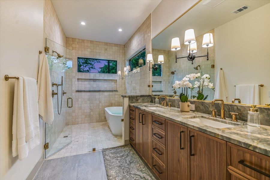 Beautifully appointed primary bath with double vanity, soaking tub, and spacious walk-in shower. Beautifully appointed primary bath with double vanity, soaking tub, and spacious walk-in shower.