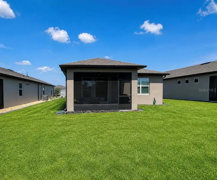Exterior details and patio area of a home in Del Webb Stone Creek, Ocala (Image 3).