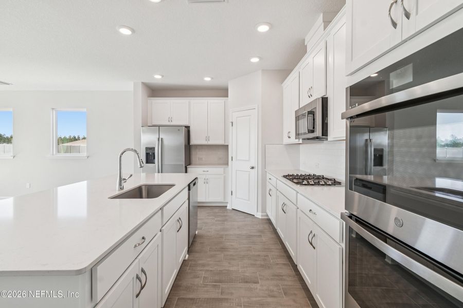 Furnished interior view inside a new home in Tributary 50', Yulee (Image 15).