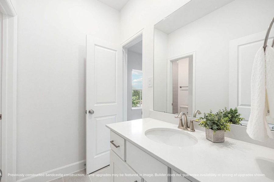 Style meets function in this fresh upstairs bath—with quartz counters, custom cabinetry, and fixtures that just feel luxe. Style meets function in this fresh upstairs bath—with quartz counters, custom cabinetry, and fixtures that just feel luxe.