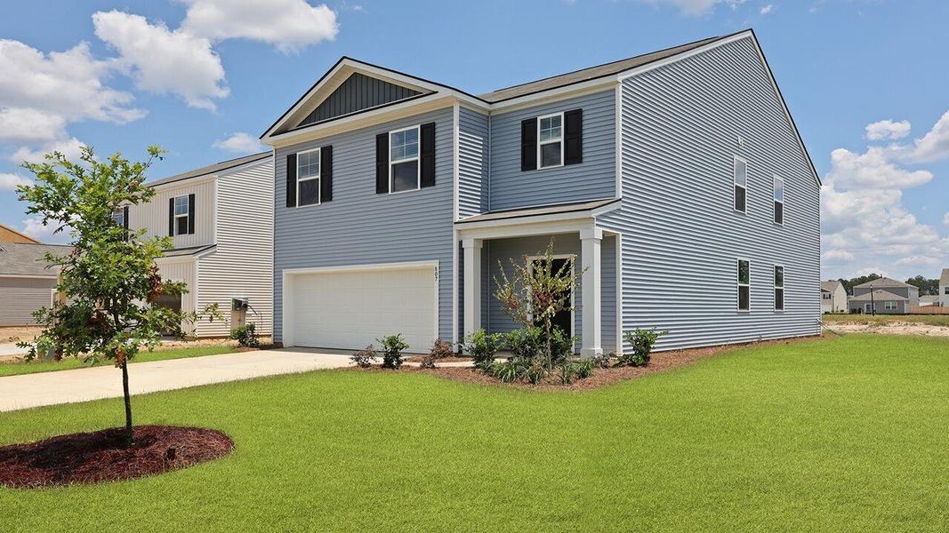 Front exterior of a new home in Pine Hills at Cane Bay, Summerville, SC, highlighting curb appeal (Image 2).