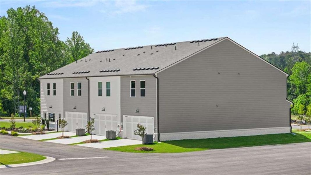 Front exterior of a new home in , Stockbridge, GA, highlighting curb appeal (Image 36).