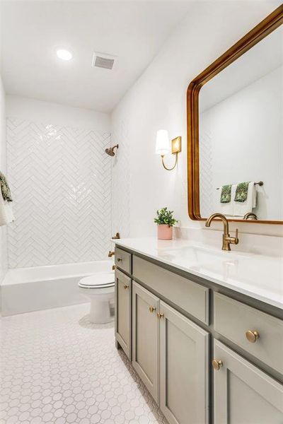 Bathroom with vanity and tub / shower combination