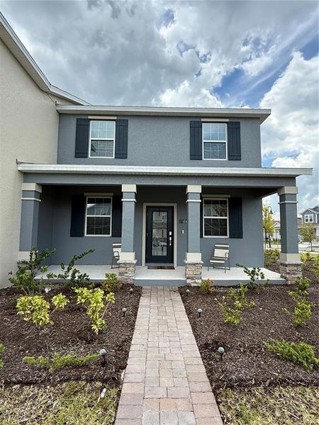 Front exterior of a new home in , Orlando, FL, highlighting curb appeal (Image 23). Front exterior of a new home in , Orlando, FL, highlighting curb appeal (Image 23).