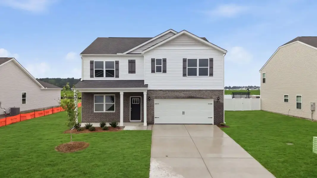 Representative exterior photo of a completed home built from the Hayden - Traditions by D.R. Horton in Savannah Place, Wilson, NC (Image 1). Representative exterior photo of a completed home built from the Hayden - Traditions by D.R. Horton in Savannah Place, Wilson, NC (Image 1).