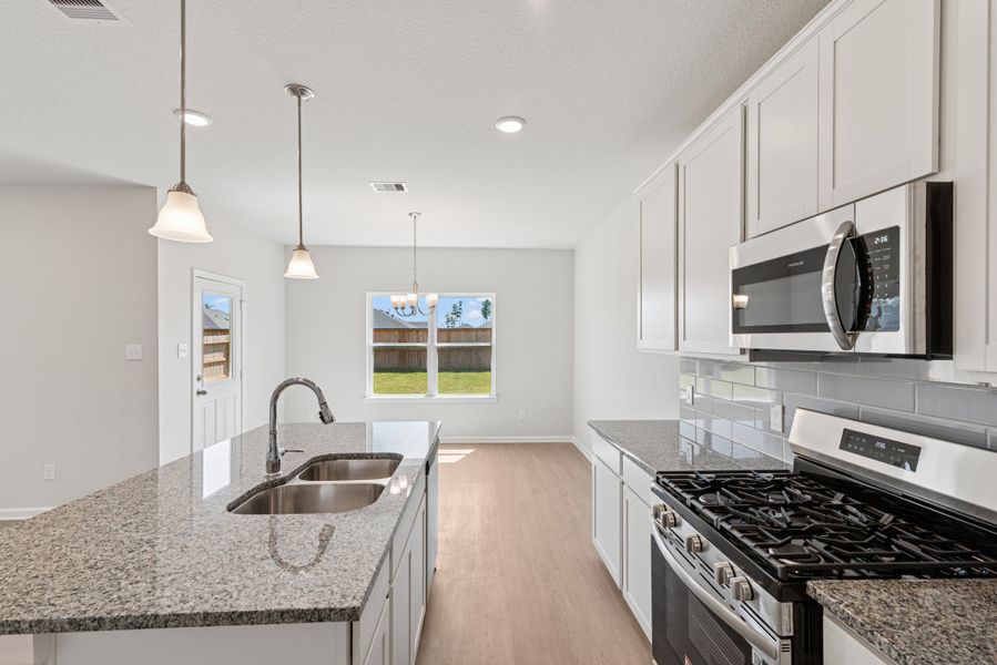 The Oriole II- Kitchen and Breakfast Area. Sample image to be used for example only, colors, options and upgrades vary.