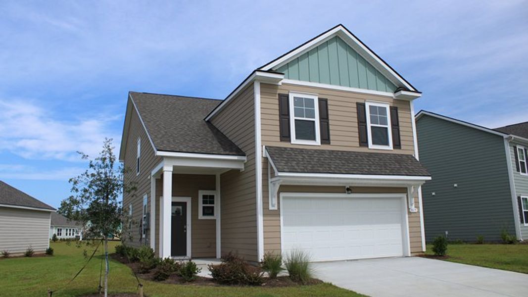 Front exterior of a new home in Auberon Woods, Conway, SC, highlighting curb appeal (Image 2).