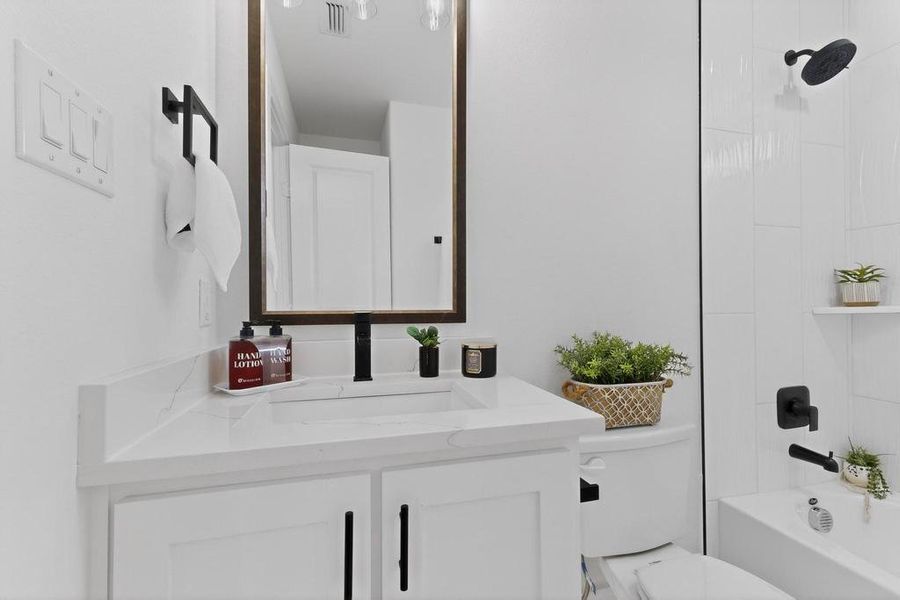Hall bathroom with vanity and shower / washtub combination Hall bathroom with vanity and shower / washtub combination