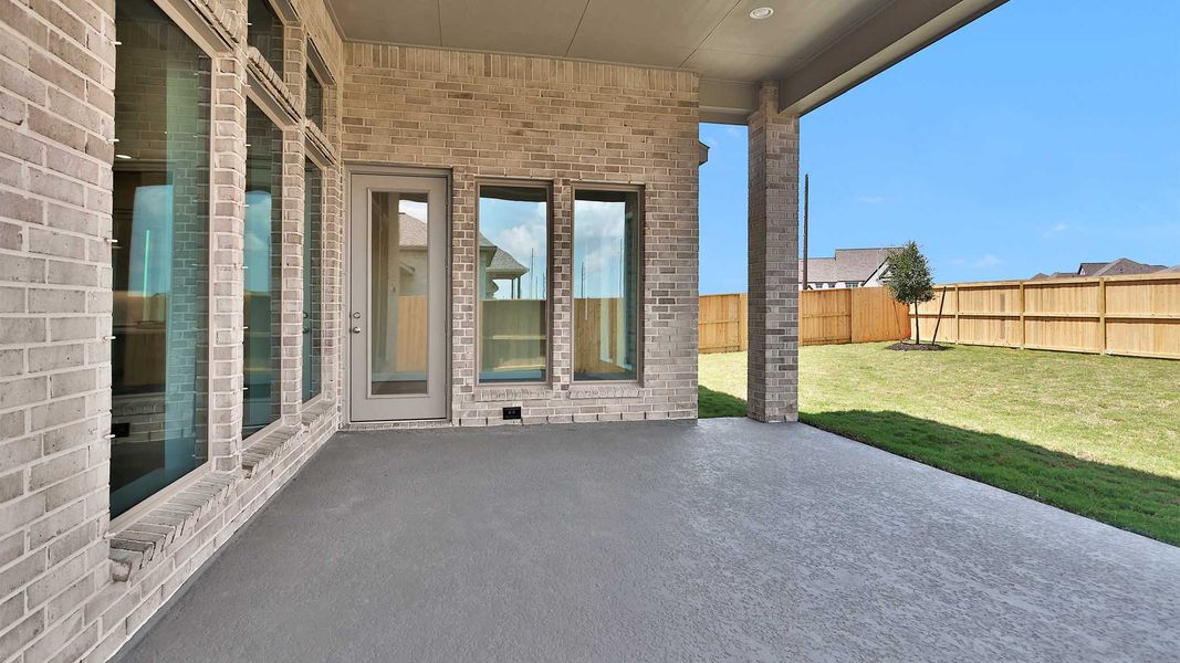 Exterior details and patio area of a home in Meridiana, Manvel (Image 4). Exterior details and patio area of a home in Meridiana, Manvel (Image 4).