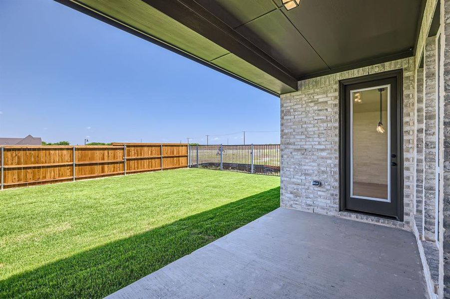 View of yard with a patio area View of yard with a patio area