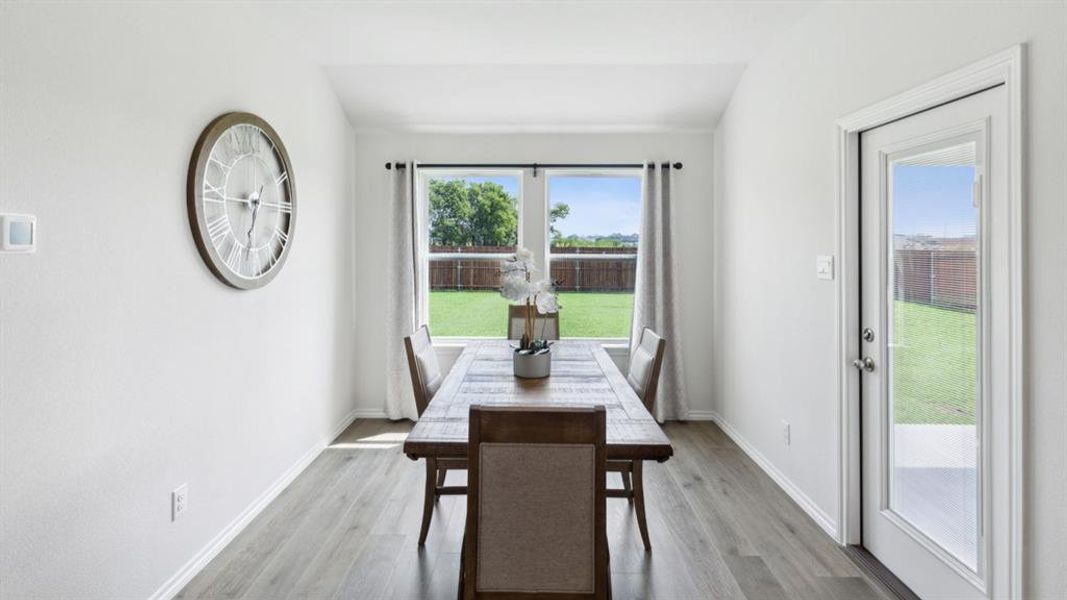 Dining area with light wood-type flooring