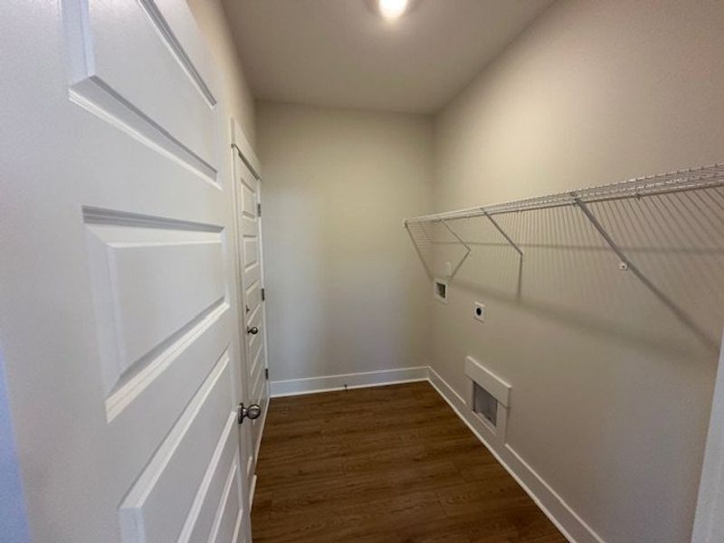 This dedicated laundry space offers practical conv