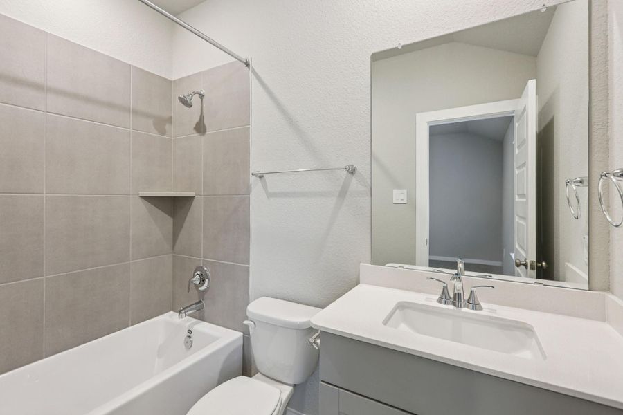 Furnished interior view inside a new home in Massey Oaks - Premier Series, Pearland (Image 4). Furnished interior view inside a new home in Massey Oaks - Premier Series, Pearland (Image 4).