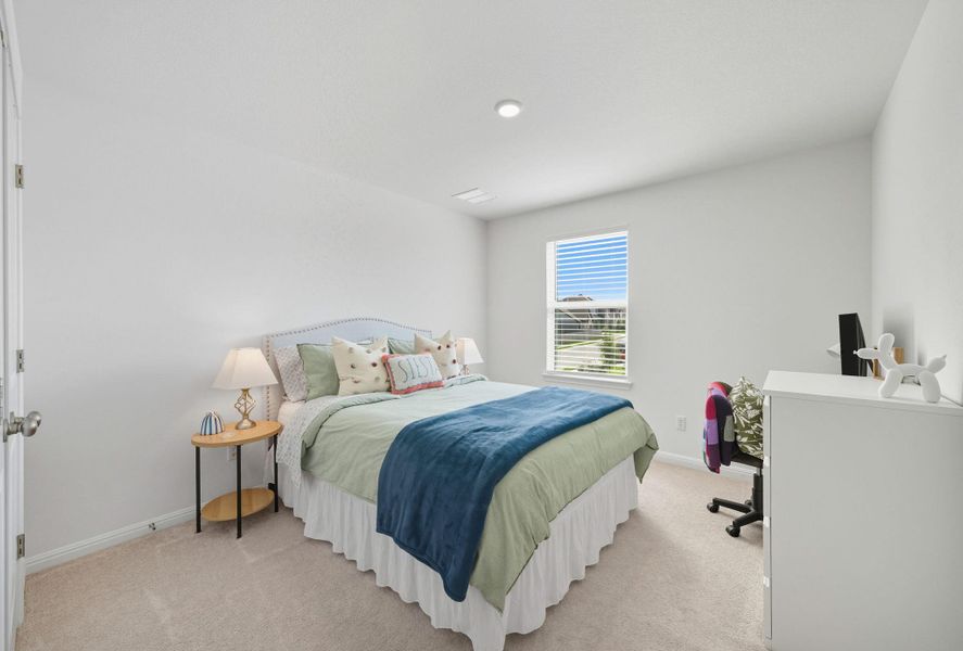 Bedroom with light carpet and baseboards Bedroom with light carpet and baseboards