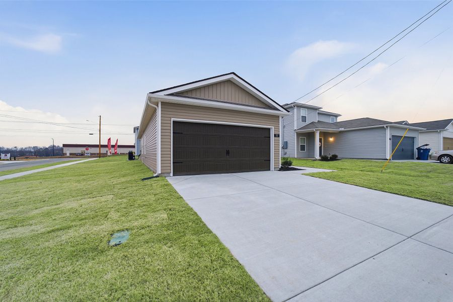 Front exterior of a new home in Stonehenge, Manchester, TN, highlighting curb appeal (Image 2). Front exterior of a new home in Stonehenge, Manchester, TN, highlighting curb appeal (Image 2).