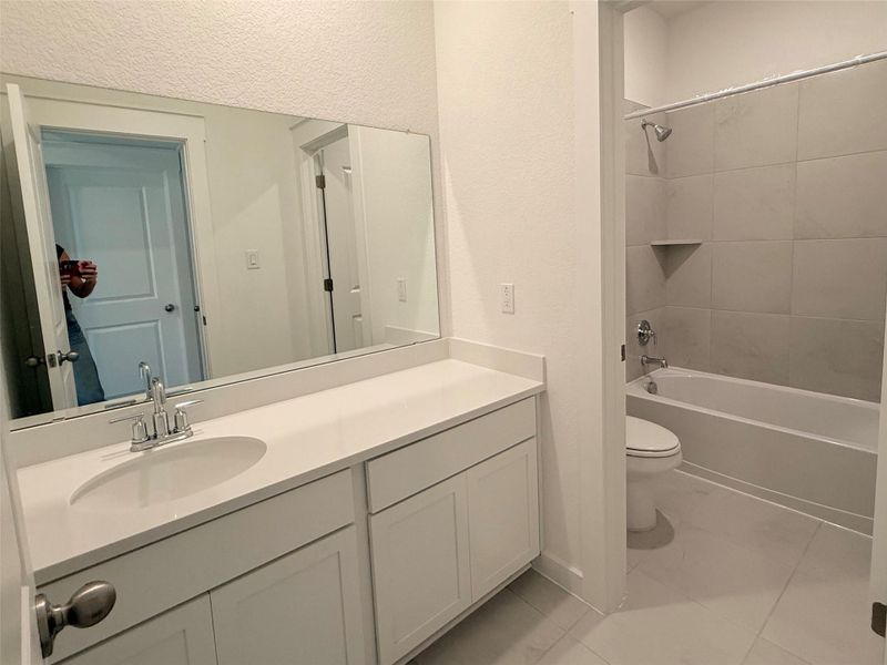 Bathroom with vanity and shower / washtub combination Bathroom with vanity and shower / washtub combination