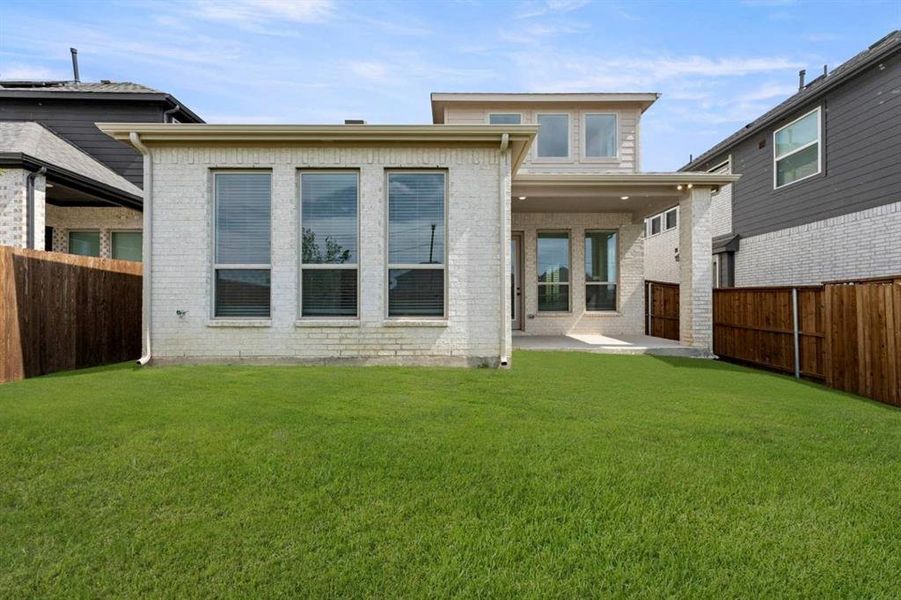 Exterior details and patio area of a home in The Villages of Hurricane Creek, Anna (Image 24).