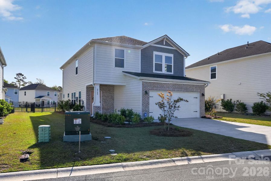 Front exterior of a new home in , Longs, SC, highlighting curb appeal (Image 23).