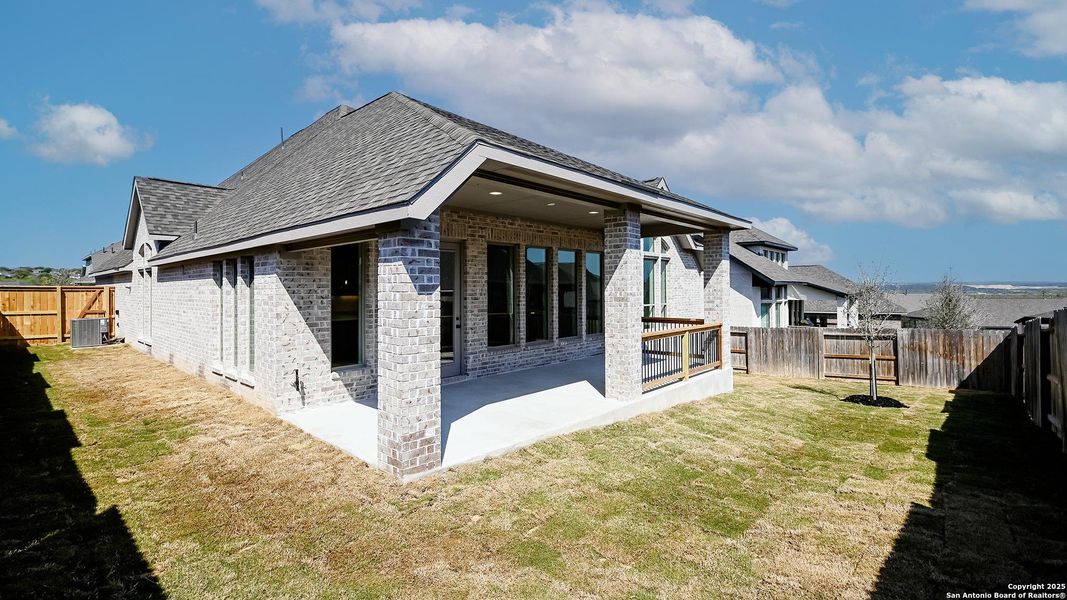 Front exterior of a new home in Homestead 65', Schertz, TX, highlighting curb appeal (Image 22).