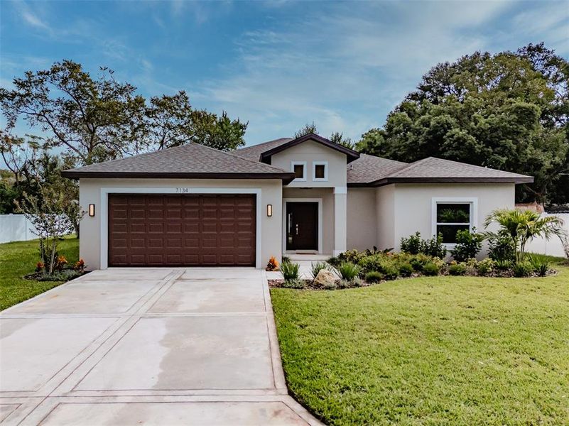 Front exterior of a new home in , New Port Richey, FL, highlighting curb appeal (Image 21).