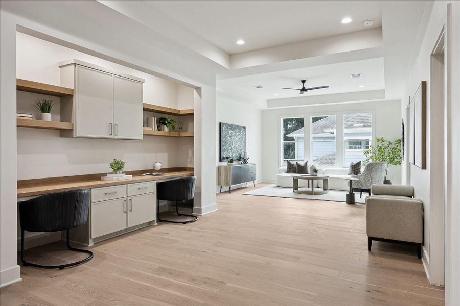 This versatile upstairs flex space is ready to fit your lifestyle, with a 10-foot tray ceiling, custom built-in desks and shelving that make it ideal for a home study, computer gaming, crafts or creative projects.